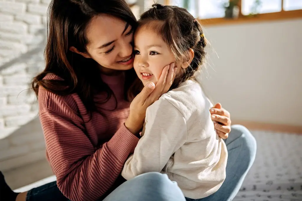 A woman holding a child